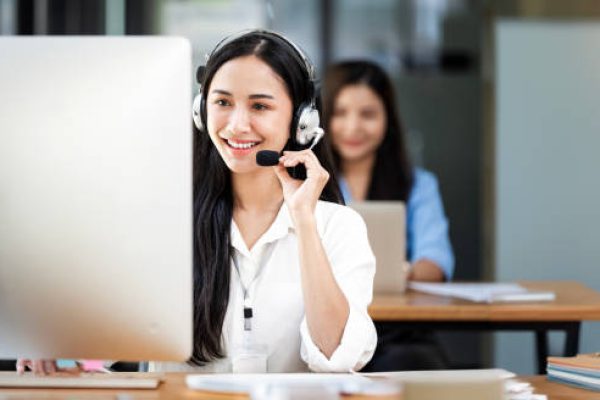 Smiling customer support operator at work.