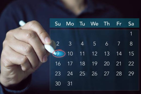 Businessperson or secretary manages time for effective work. Calendar on the virtual screen interface. Time management concept.