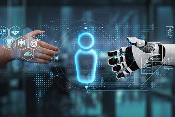 This image captures a symbolic interaction between a human hand and a robotic hand, representing the collaboration between humanity and technology in modern business environments. Auvana