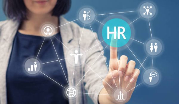 Businesswoman pressing human resources button on digital touch screen. Human resource management concept.